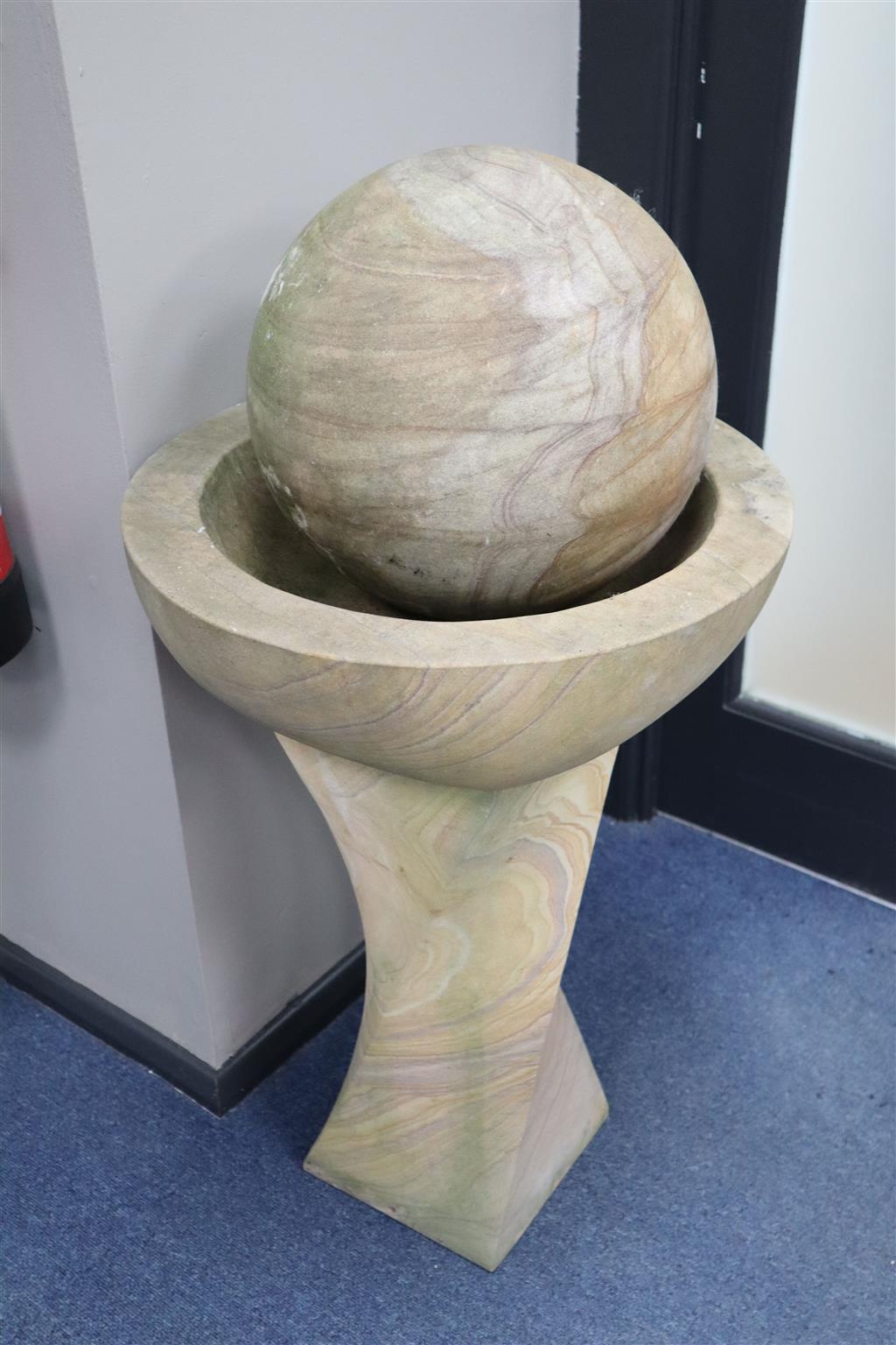 A marble ball on stand garden ornament, height 85cm